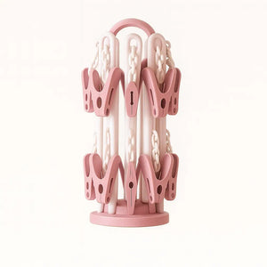 Folded pink baby laundry hanger with 20 secure clips