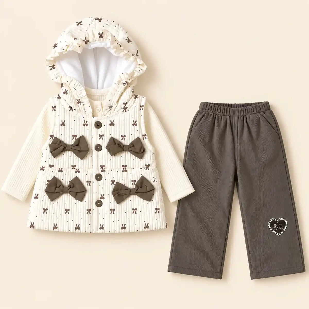 Girls 3 piece winter outfit with cream hooded vest featuring brown bow print, ribbed top and grey pajama with heart detail