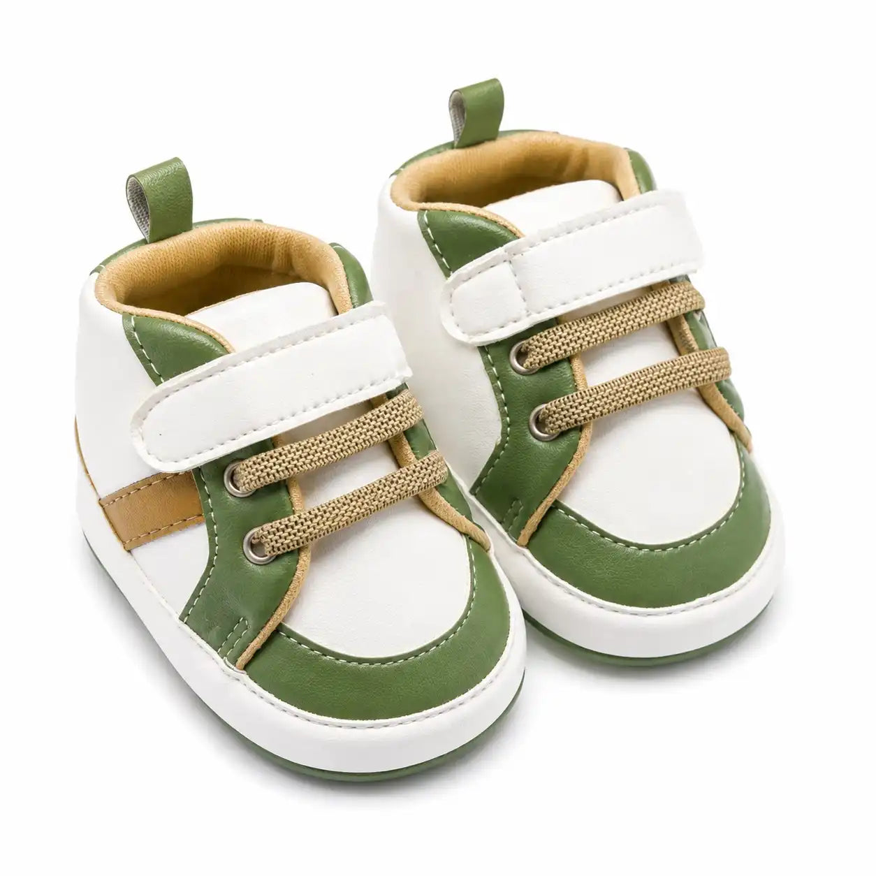 Green and white casual baby shoes with strap closure and beige accents angled view