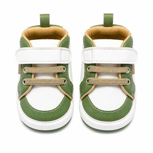 Green and white strap baby shoes with beige lace detailing front view