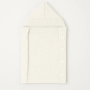 White knitted woolen baby carry nest with button closure for winter
