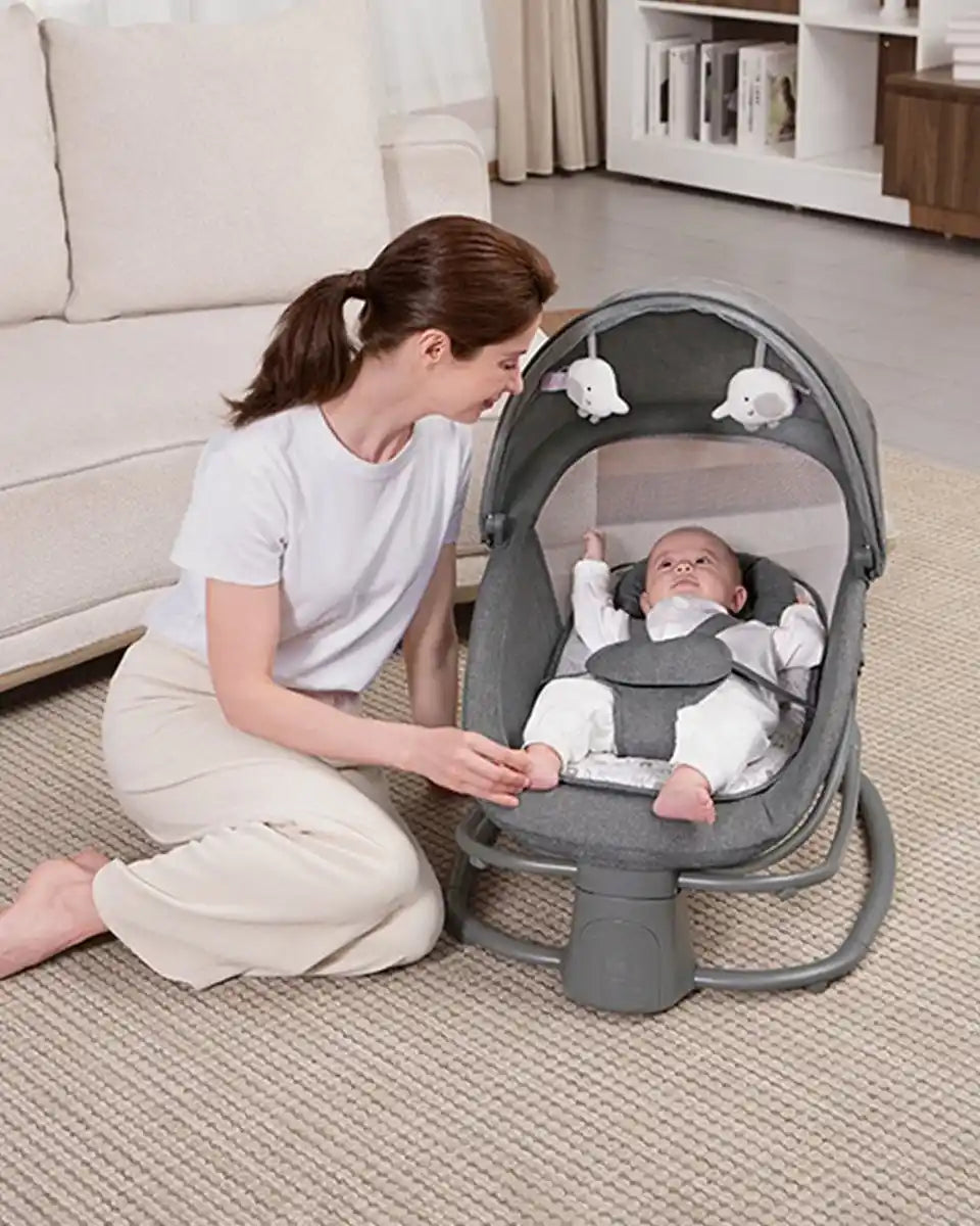 Mastela 4-in-1 Bassinet Swing 8087 lifestyle view with baby
