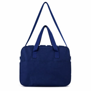 Navy blue baby diaper bag back view with shoulder strap