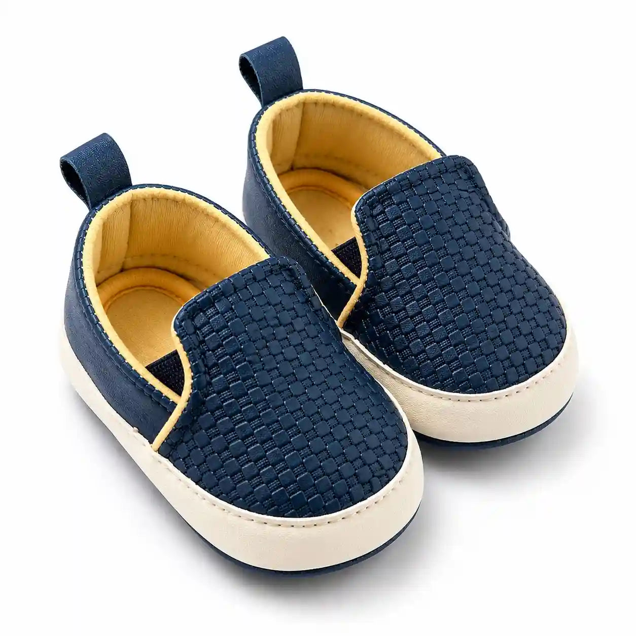 Navy blue textured casual baby shoes with cream soft sole angled view