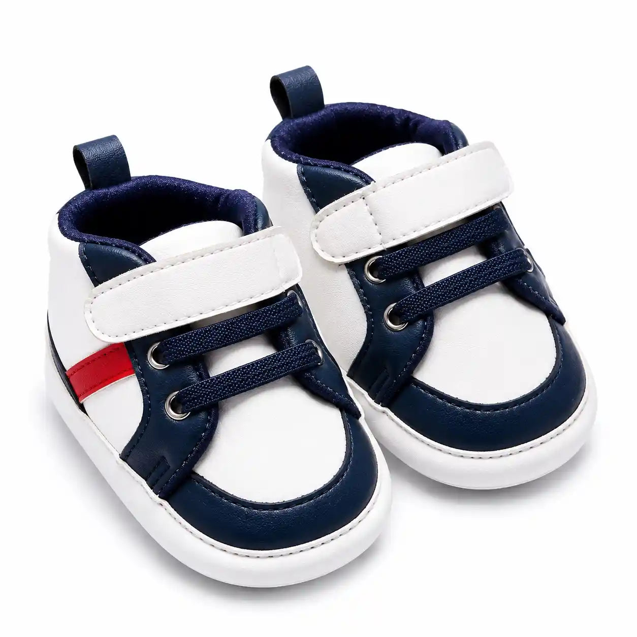 White and navy blue casual baby shoes with red side accent angled view