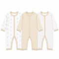 Pack of 3 full sleeve baby rompers in printed, solid cream beige and striped cream beige designs with front snap button closure