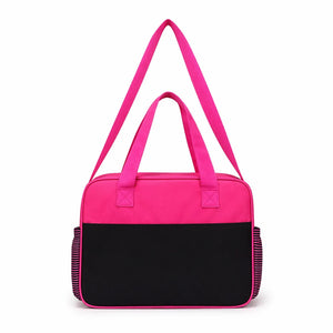 Pink baby diaper bag back view with carry handles and shoulder strap