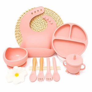 Pink silicone baby feeding set with adjustable bib, suction bowl and cutlery