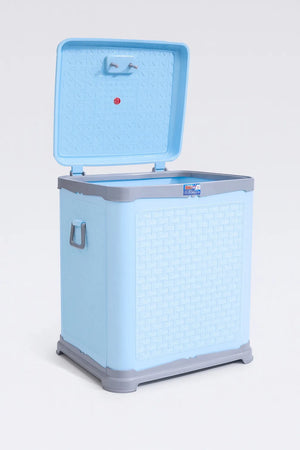 Light blue plastic laundry basket side view with woven texture