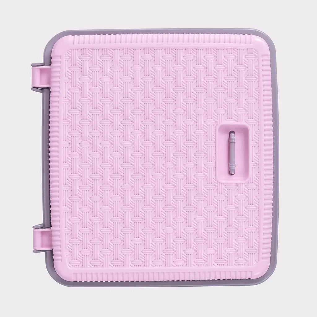 Pink woven plastic laundry basket side view with handle
