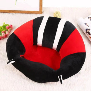 Red and black plush baby sitting chair shown in an indoor setting