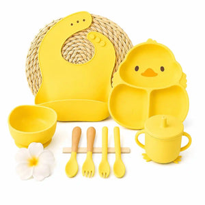 Yellow silicone baby feeding set with suction plate, silicone bib and utensils