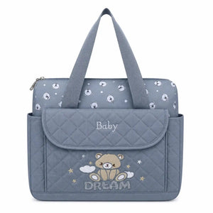 Grey baby diaper bag with spacious main compartment and changing sheet
