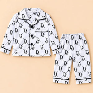 Black-and-white monogram print baby night suit with a collared button-front shirt and matching elastic-waist pajamas