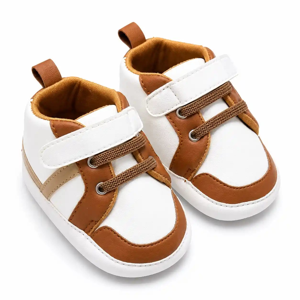 White and brown casual baby shoes with strap closure angled view
