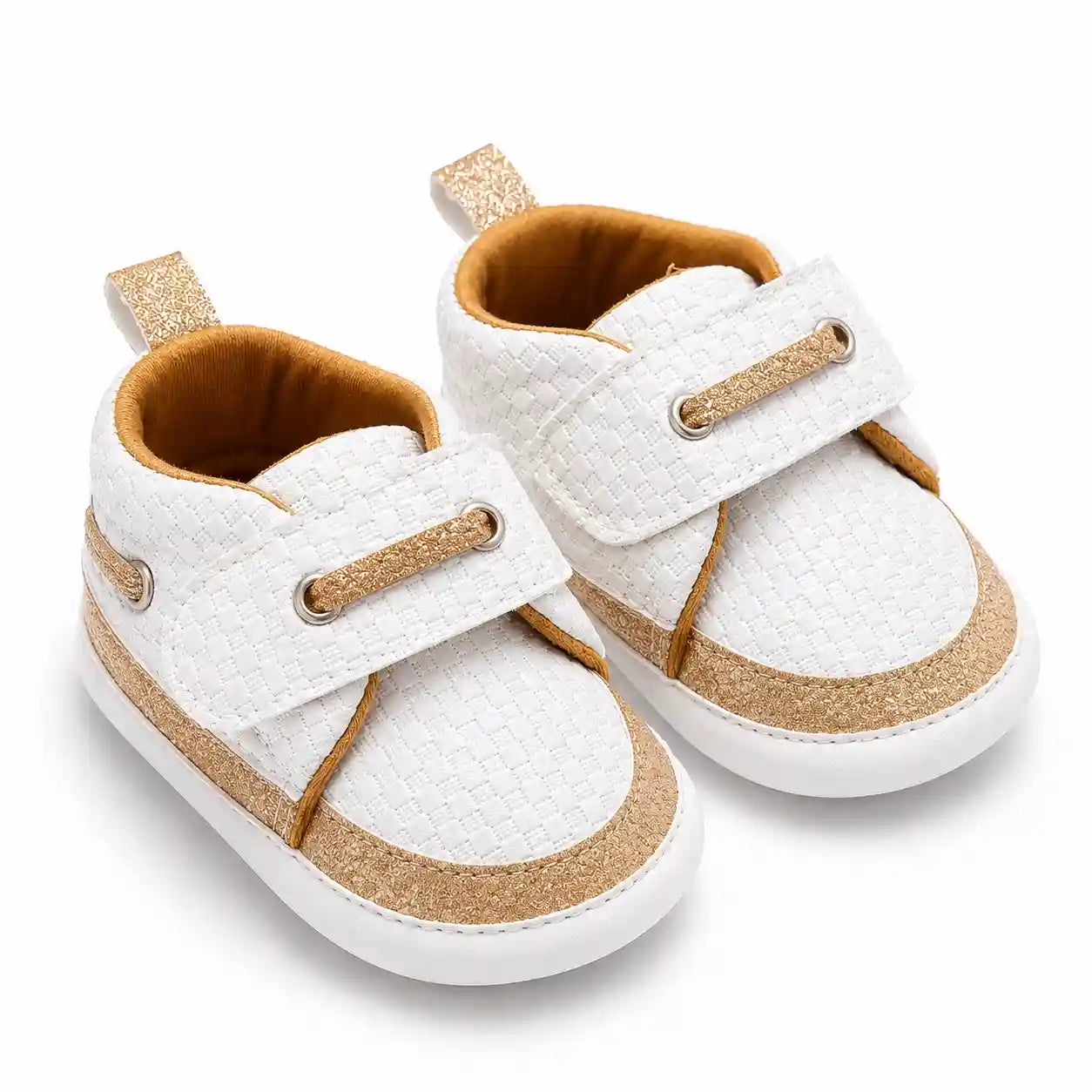 White textured baby shoes with golden glitter accents and wide strap angled view