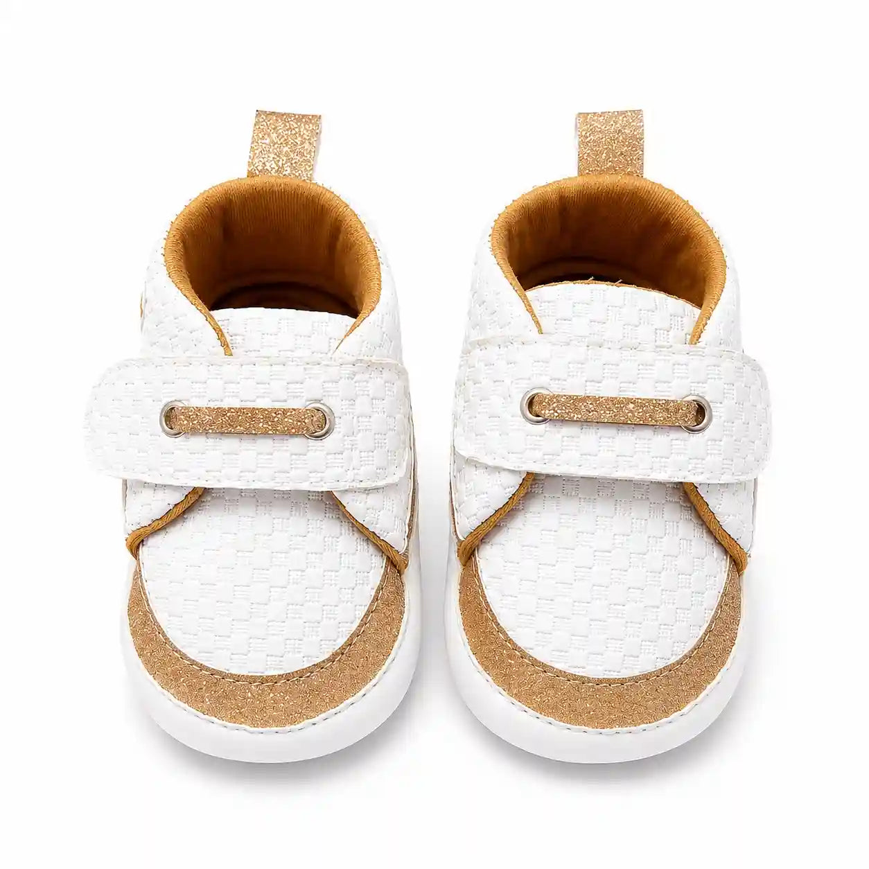 White baby shoes with golden glitter detailing and strap closure front view