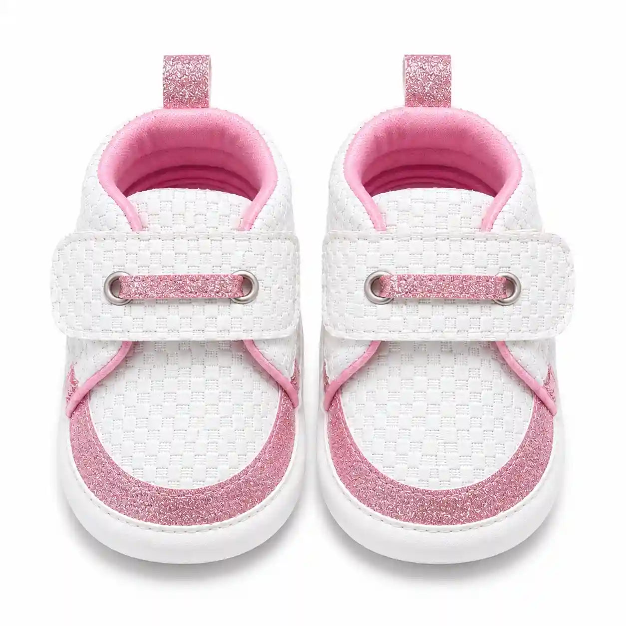 White and pink glitter baby shoes with textured upper and strap closure front view